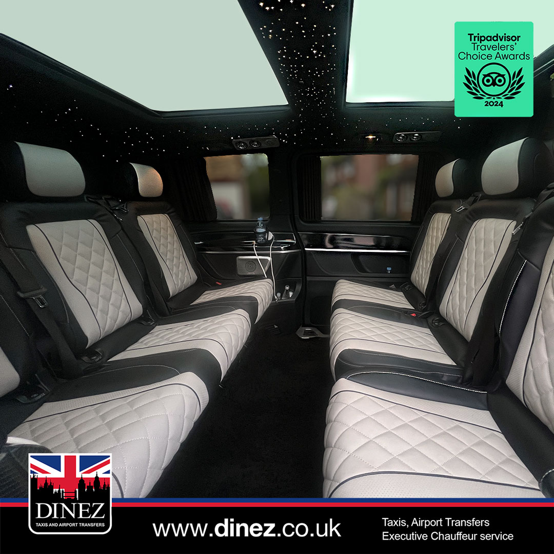 Two-tone diamond-quilted facing conference seats under a panoramic starlight roof inside a Mercedes-Benz V-Class from the